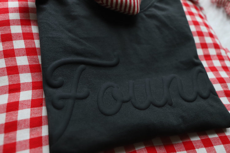 FOUND. (black on black baggy tee)