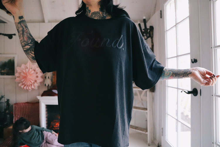 FOUND. (black on black baggy tee)